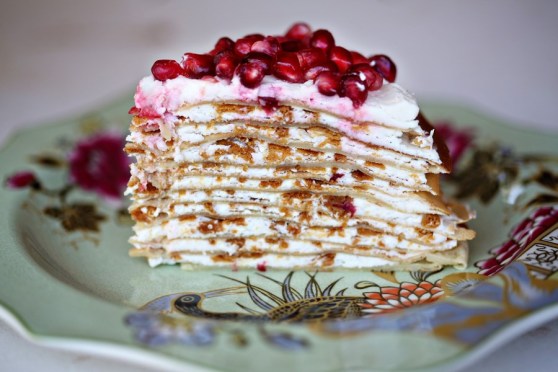 Crepe Cake with Lemon Buttercream, topped with Pomegranate Seeds