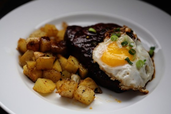 Pork Chops with Home Fries and a Fried Egg